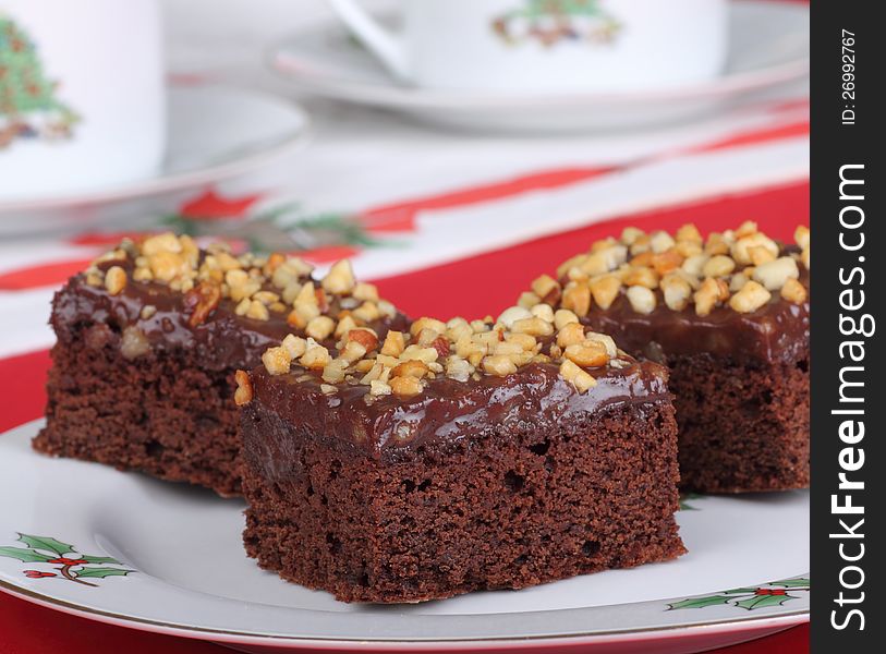 Christmas plate of fudge brownies topped with nuts. Christmas plate of fudge brownies topped with nuts