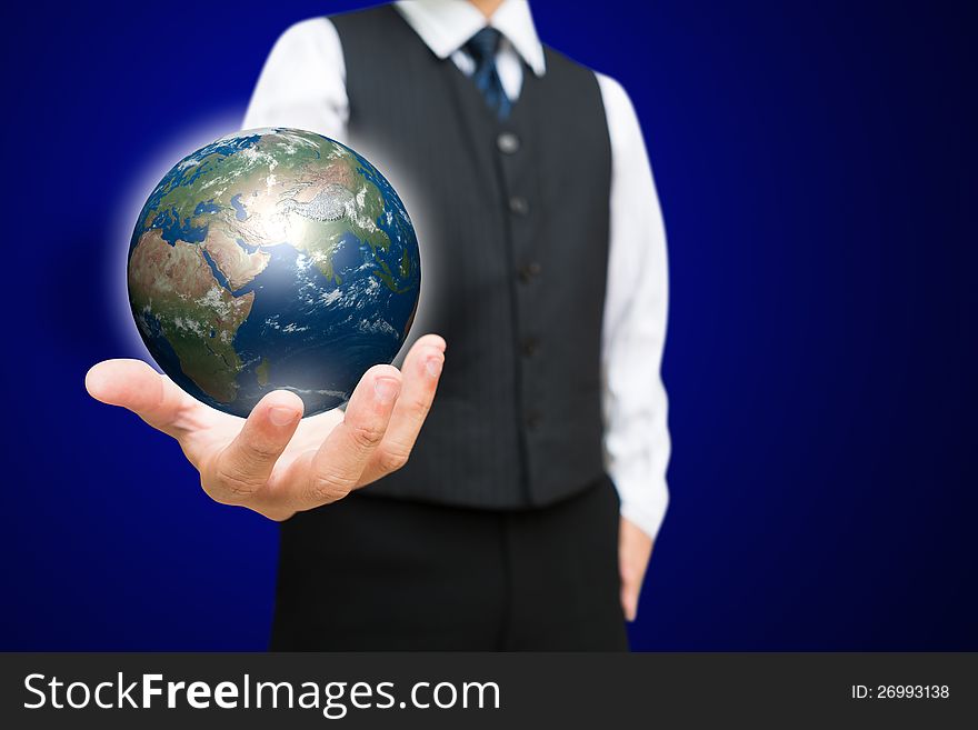 Business man with the digital globe ball on his hand, Elements of this image furnished by NASA. Business man with the digital globe ball on his hand, Elements of this image furnished by NASA