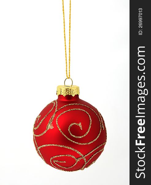 Hanging red glass ball on the white background. Hanging red glass ball on the white background
