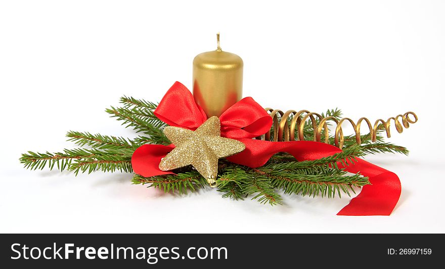 Christmas decoration with the gold star, twigs of the spruce and candle