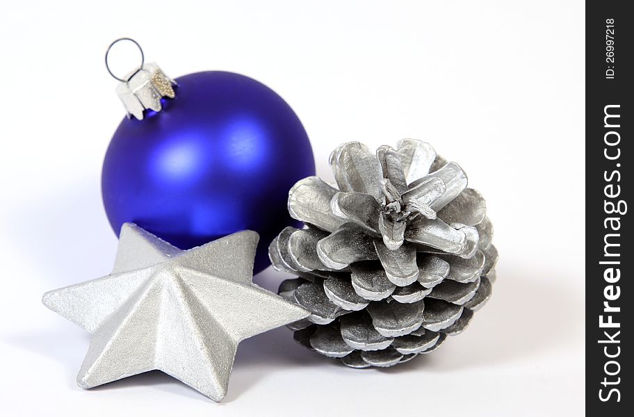 Christmas decoration with the silver star, cone and bauble