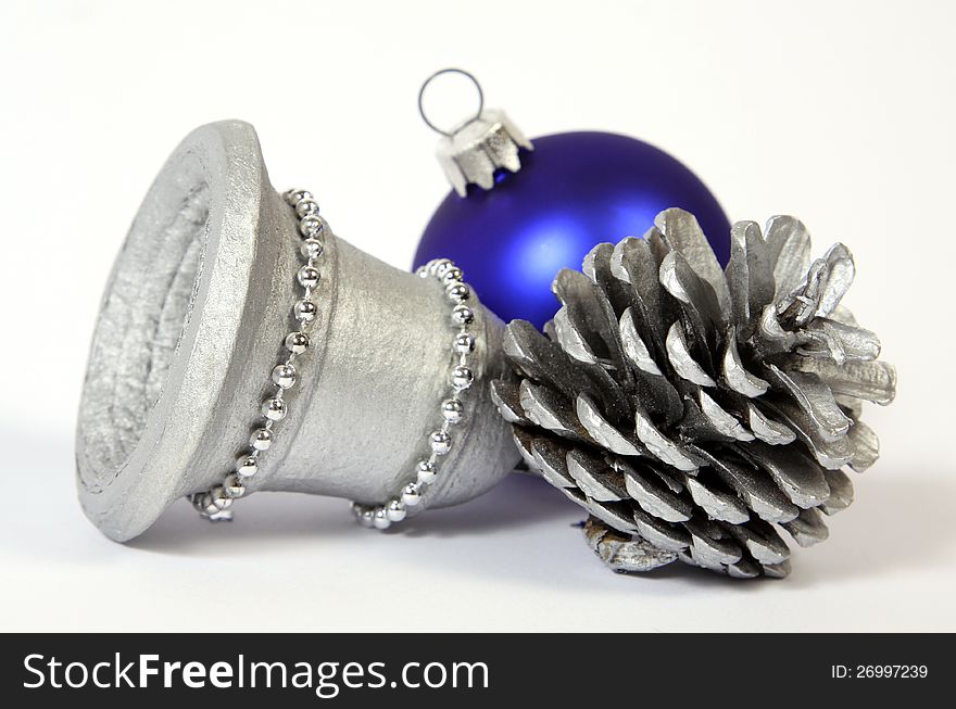 Christmas decoration with the bell, cone and bauble