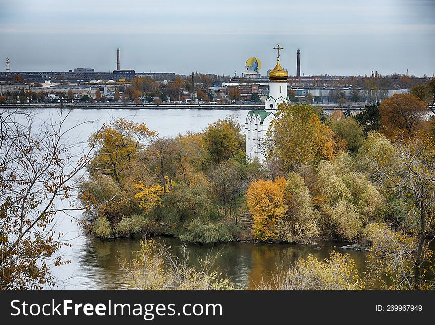 Autumn City View. Autumn Colored Trees And River