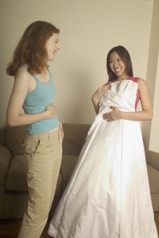 Girl Shows Her Friend Her Wedding Dress Royalty Free Stock Photography Girl Shows Her Friend Her Wedding Dress Royalty Free Stock Photography