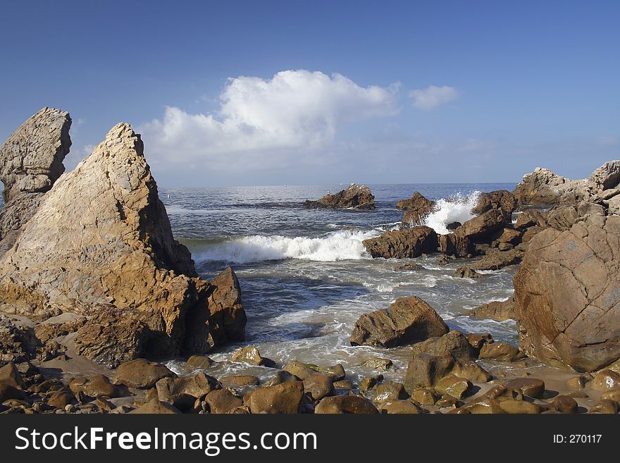 A wave crashing on the rocks of Corona del Mar, CA. A wave crashing on the rocks of Corona del Mar, CA