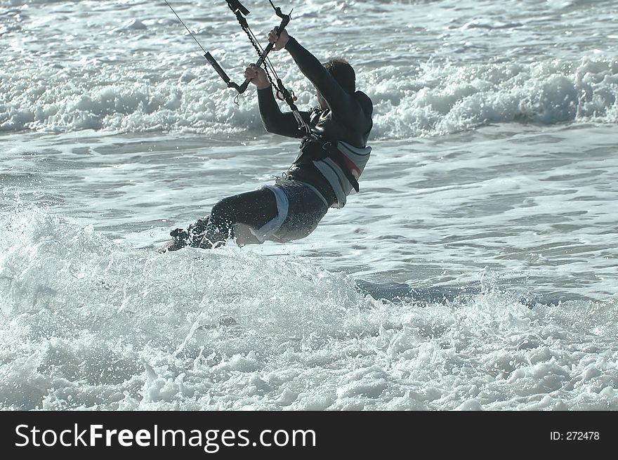 Kite surfer in the waves. Kite surfer in the waves