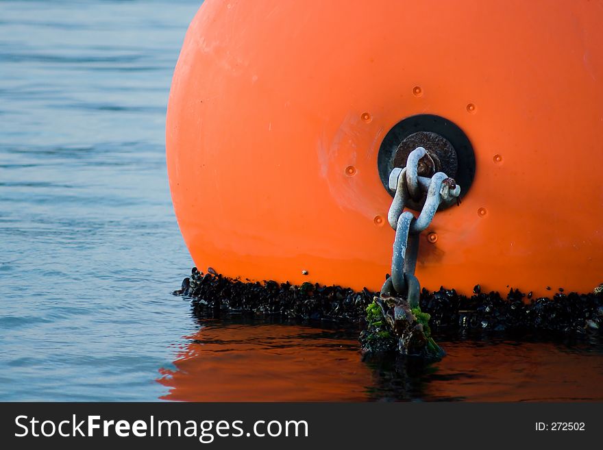 Orange buoy with chain