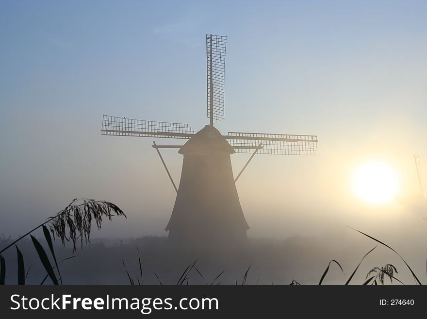 Windmill At A Misty Morning