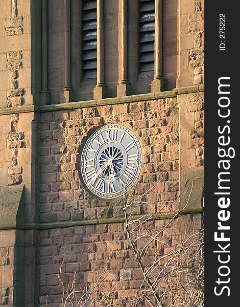 Winter Trees in Front of English Church Clock. Winter Trees in Front of English Church Clock