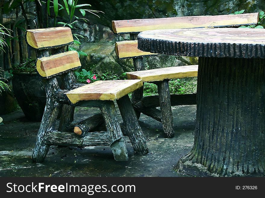 Wooden Chairs & Table in the garden