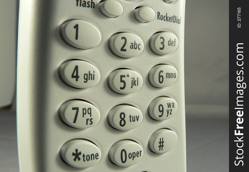 A close up shot of a standard touch tone phone dialing pad. Includes all numbers and some other buttons. A close up shot of a standard touch tone phone dialing pad. Includes all numbers and some other buttons.