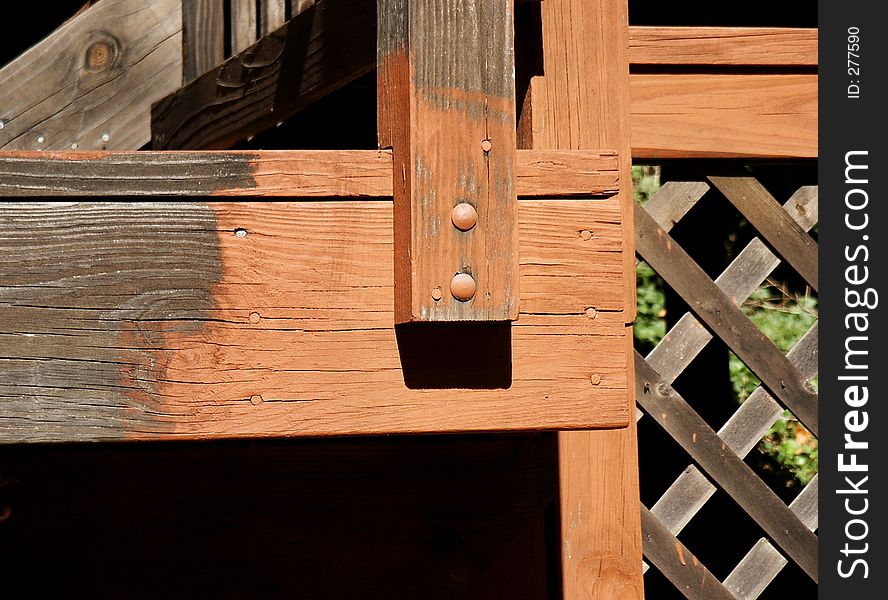 Close-up of stained and unstained portions of wood deck. Close-up of stained and unstained portions of wood deck