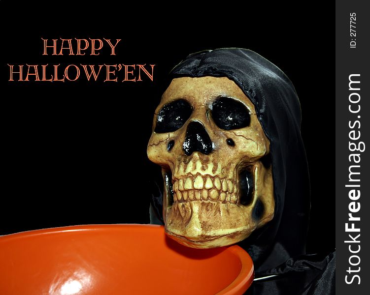Skull hodling a candy dish/bowl with happy hallowe'en written