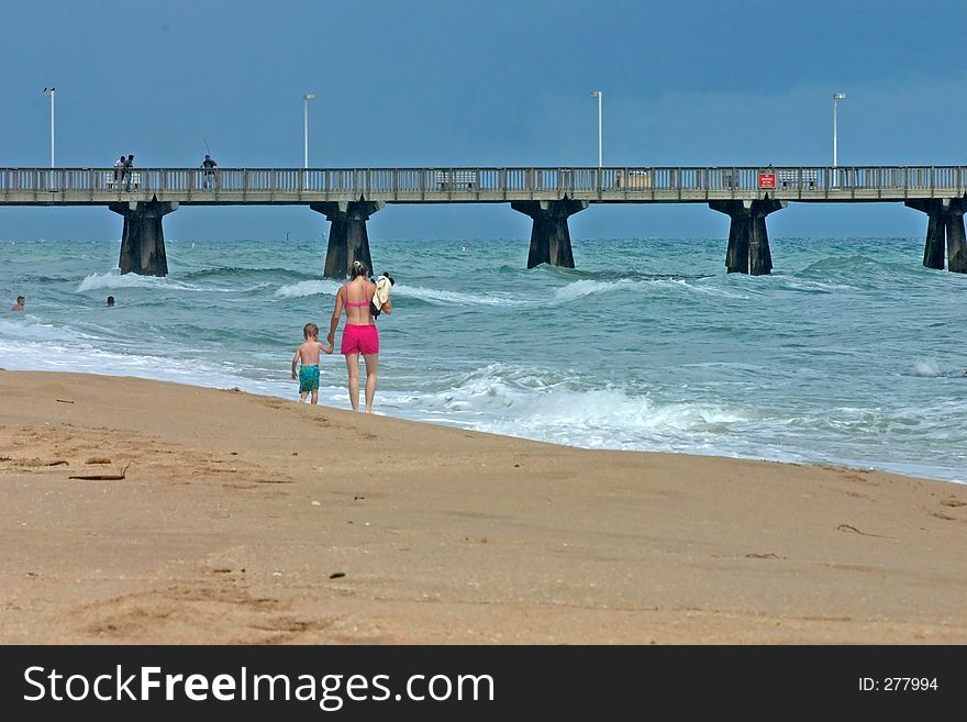 Family Walking On Beach