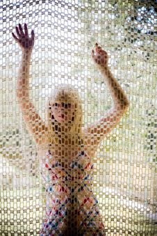 Young Blonde Girl Behind A Net Royalty Free Stock Image Young Blonde Girl Behind A Net Royalty Free Stock Image