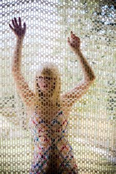 Young Blonde Girl Behind A Net Royalty Free Stock Images Young Blonde Girl Behind A Net Royalty Free Stock Images