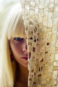 Blond Woman S Face Behind Net Royalty Free Stock Images