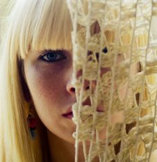 Blond Woman S Face Behind Net Stock Image Blond Woman S Face Behind Net Stock Image