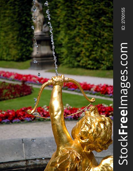 Golden fountain - Cupid shooting an arrow of water