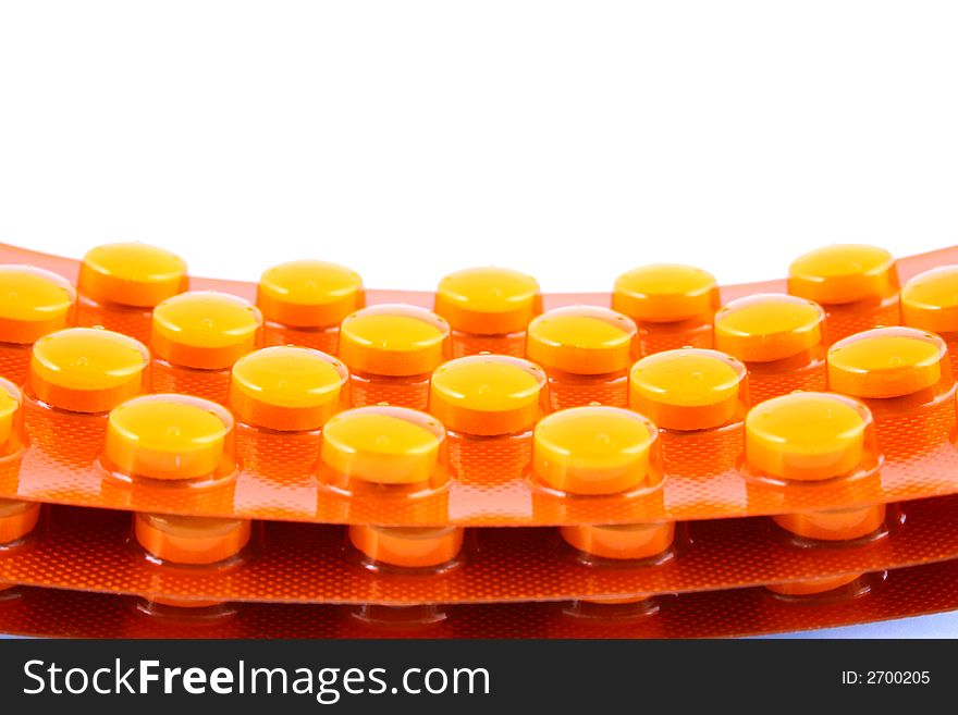 Tablets and vitamin pills in different shapes and colors. Tablets and vitamin pills in different shapes and colors