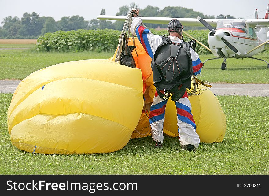 View of parachutist directly after landing. View of parachutist directly after landing