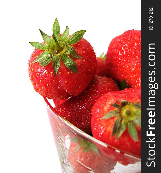 Strawberry in glass over white background