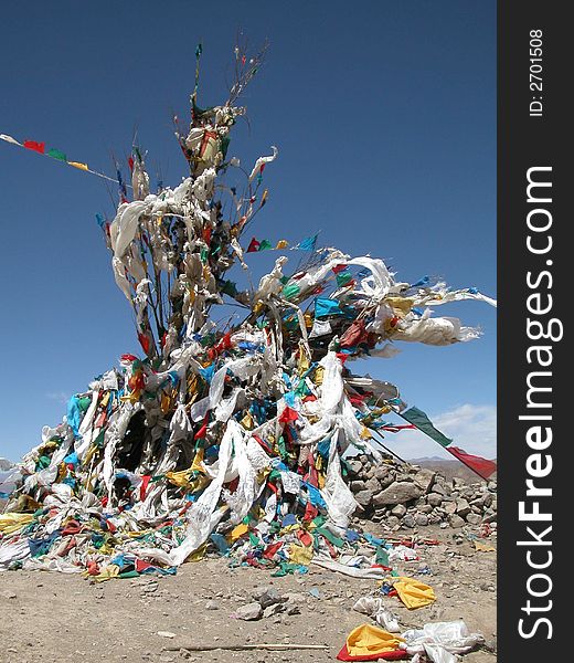 Prayer flags on the mountain peak in Tibet, China. Prayer flags on the mountain peak in Tibet, China