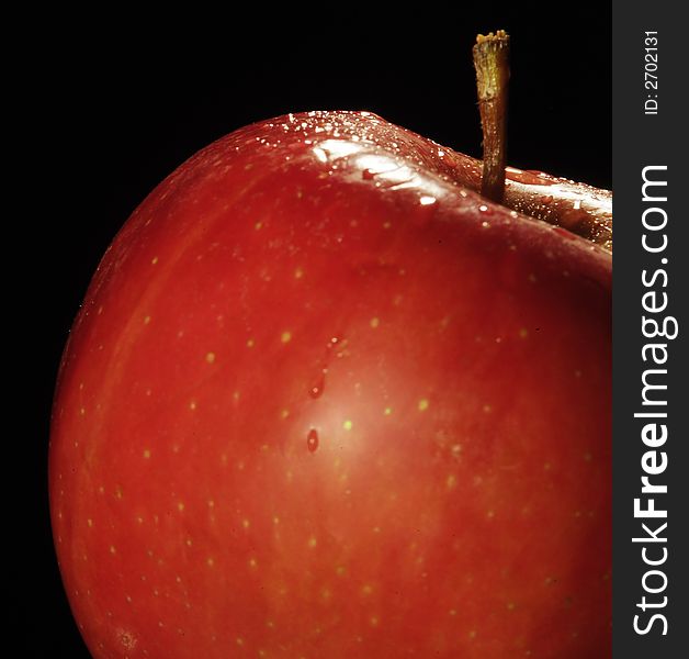 Red apple isolated on a black background