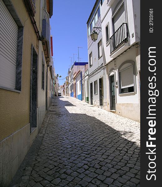 Narrow stone street in Portugal. Narrow stone street in Portugal