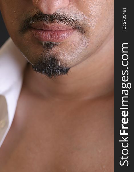 Part of a young man´s face with moustache