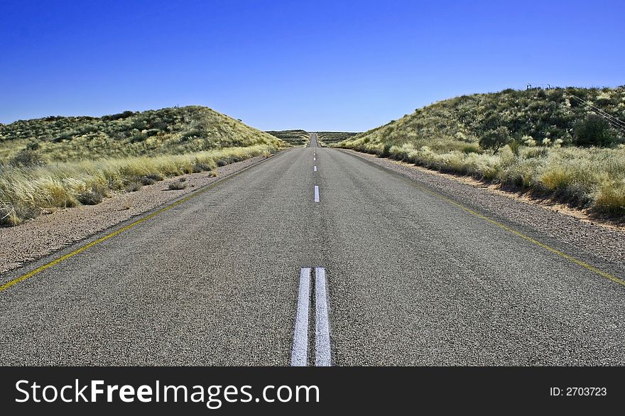 Endless road with blue sky