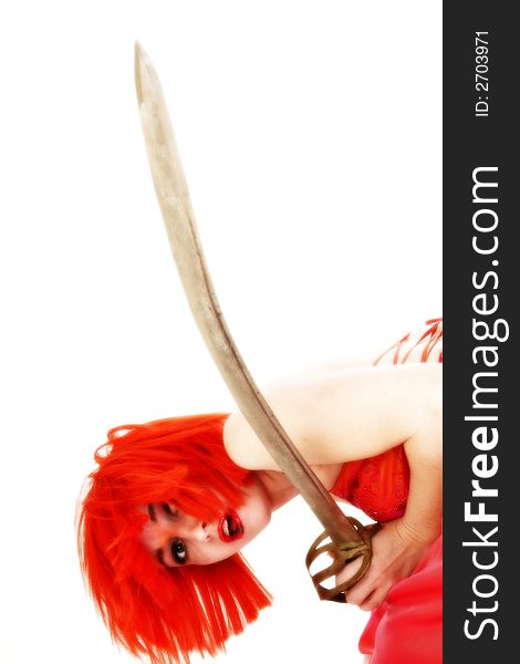 High key goth. Beautiful woman with red hair, red dress with sword. Over white. High key goth. Beautiful woman with red hair, red dress with sword. Over white.