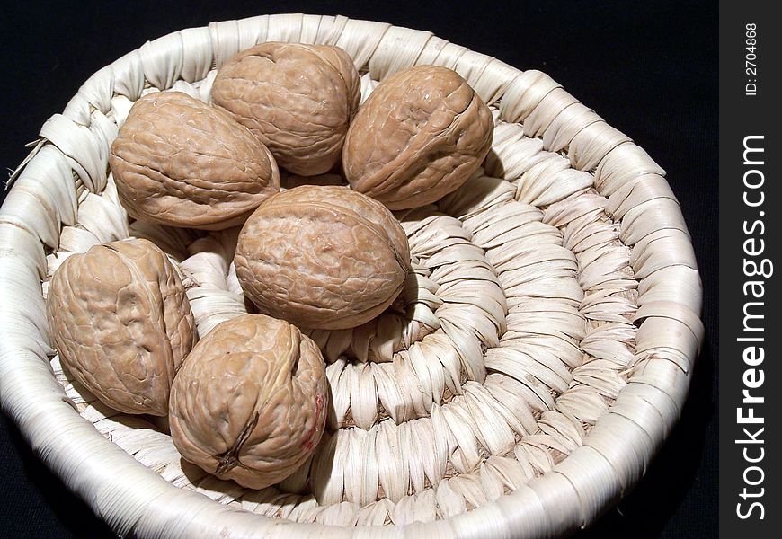 Walnuts on a handmade wickerwork