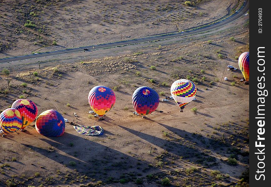 A hot air balloon launch seen from the air. A hot air balloon launch seen from the air