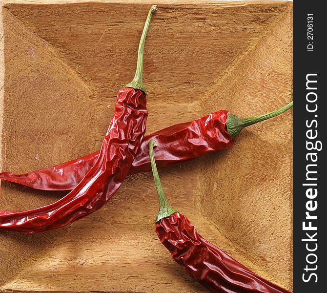 Rough wooden bowl with red hot pepper. Rough wooden bowl with red hot pepper