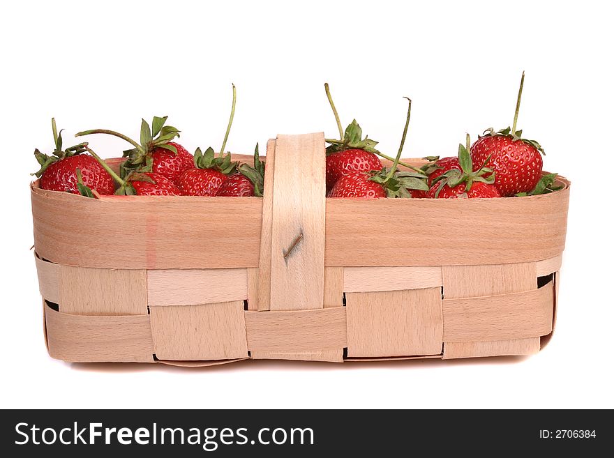 Strawberries in wooden basket isolated over white background. Strawberries in wooden basket isolated over white background