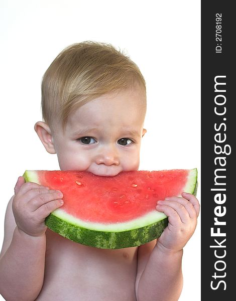 Image of cute toddler eating a big piece of watermelon. Image of cute toddler eating a big piece of watermelon