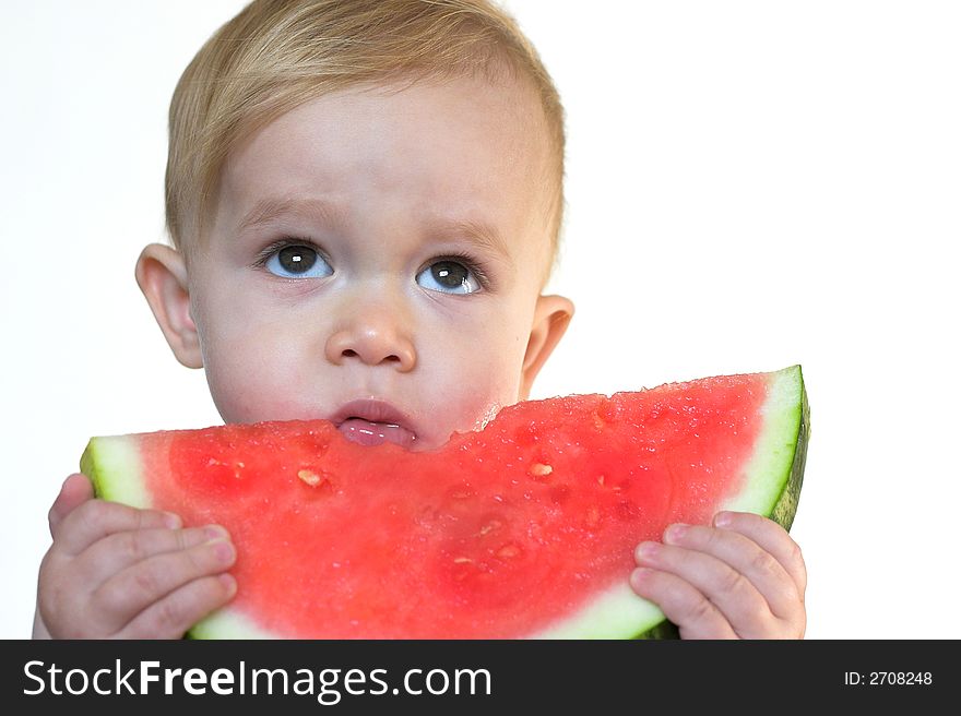 Image of cute toddler eating a big piece of watermelon. Image of cute toddler eating a big piece of watermelon