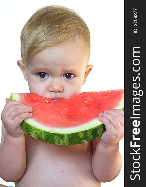 Image of cute toddler eating a big piece of watermelon. Image of cute toddler eating a big piece of watermelon