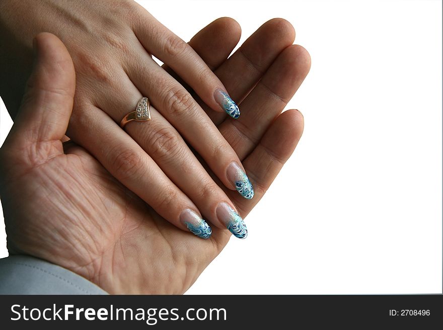 The female hand with manicure lays in a man's palm. The isolated image