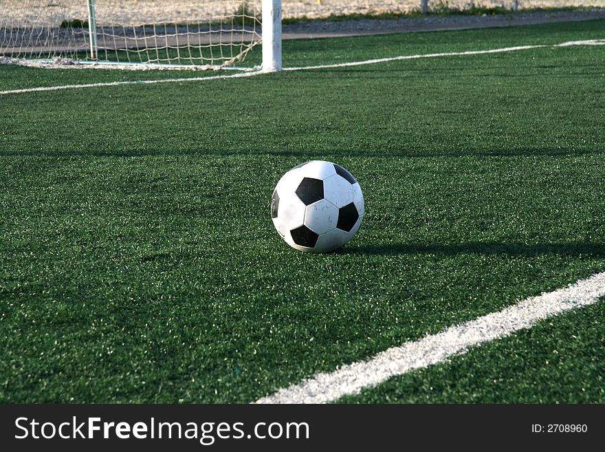 The new football lays on an artificial covering of stadium