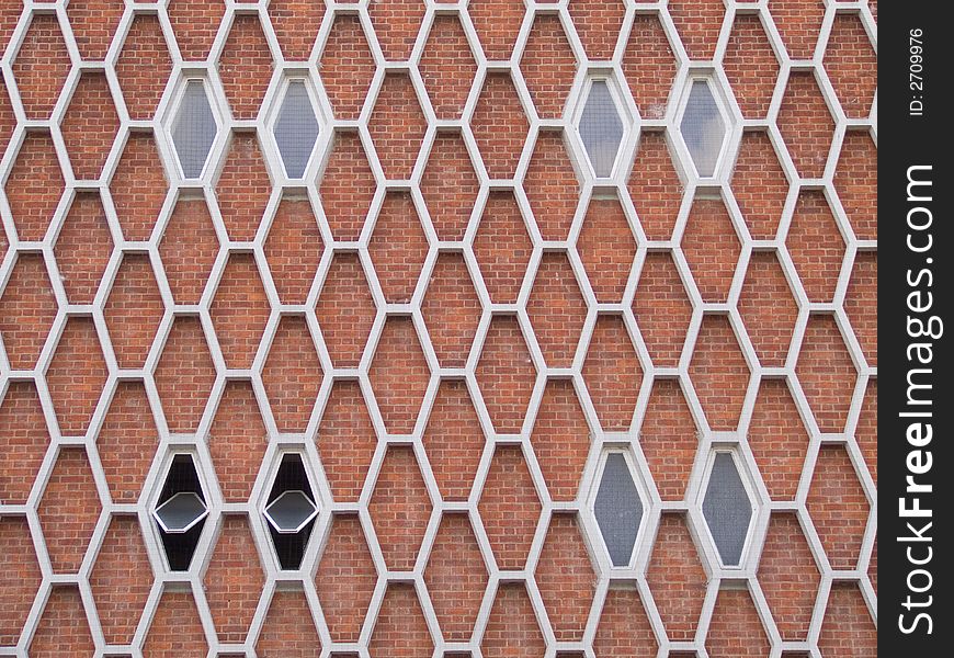 Exterior face of a 1960's brick building with honeycomb pattern facade. Exterior face of a 1960's brick building with honeycomb pattern facade