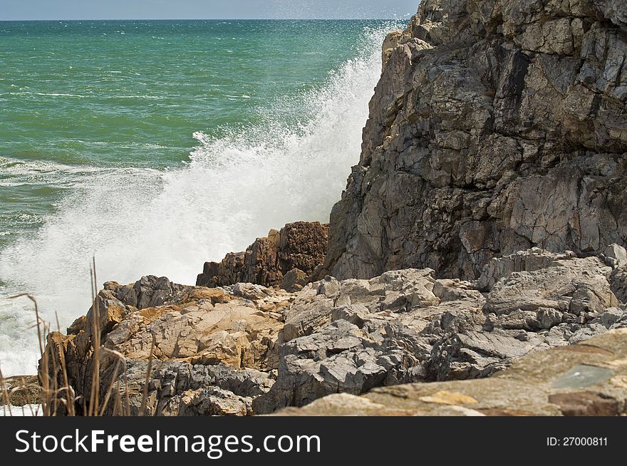 This is a splash of ocean against the rocks of the sea. This is a splash of ocean against the rocks of the sea.