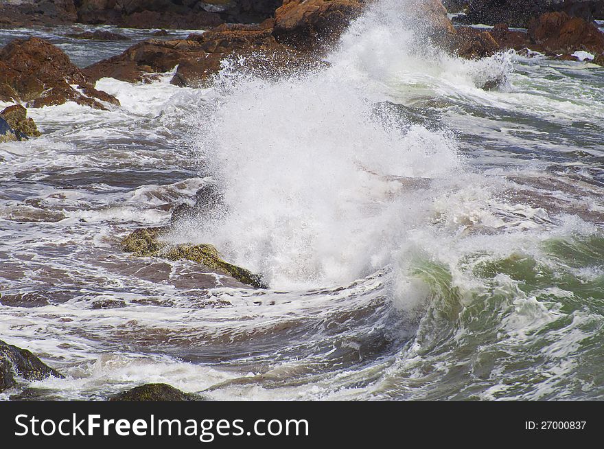 This is the swirl of the ocean waves hitting the rocks.
