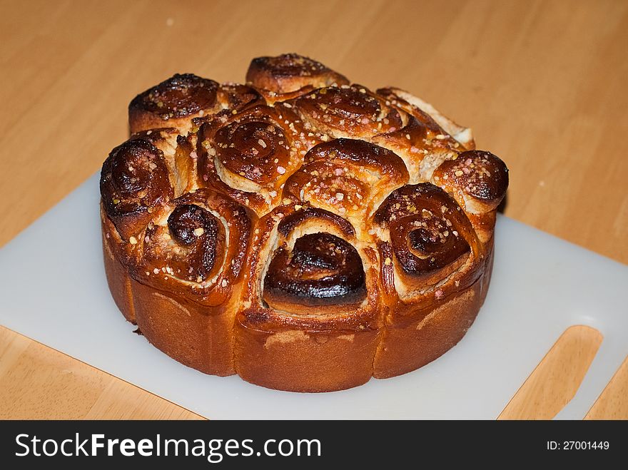 A sweet cinnamon roll cake baked fresh from the oven. A sweet cinnamon roll cake baked fresh from the oven.