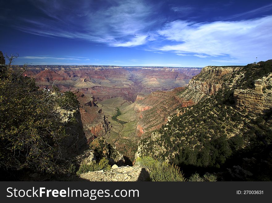 Wide angle view of the grand canyon deep blue sky bachground. Wide angle view of the grand canyon deep blue sky bachground