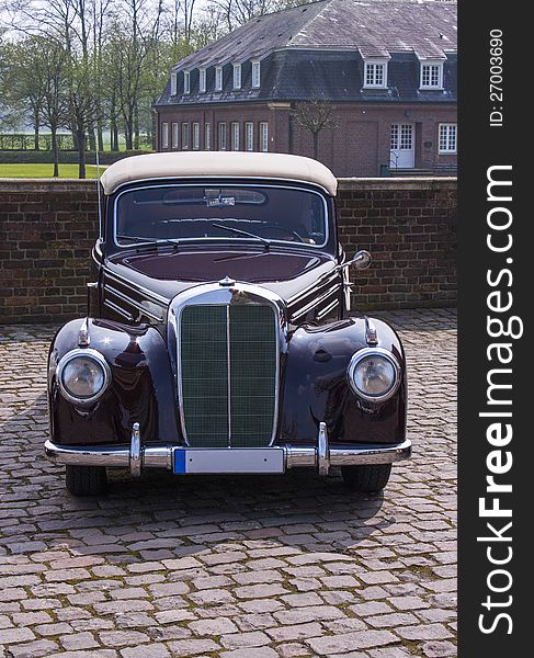 Classic car in castle courtyard