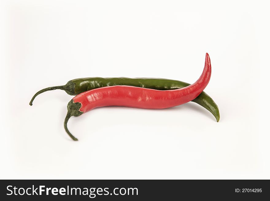 Two chilli peppers on white backgeround