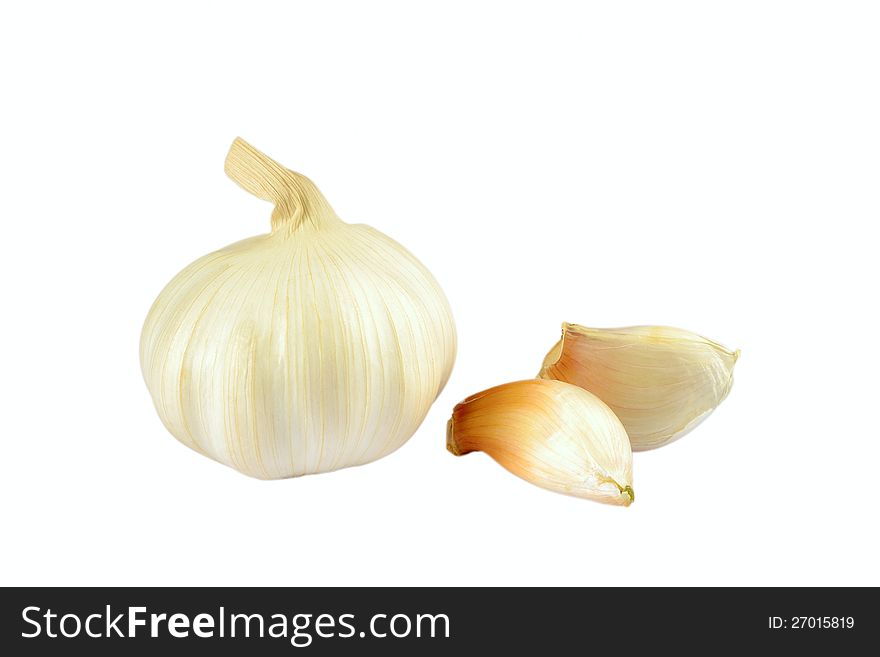 Garlic and cloves of garlic on a white background