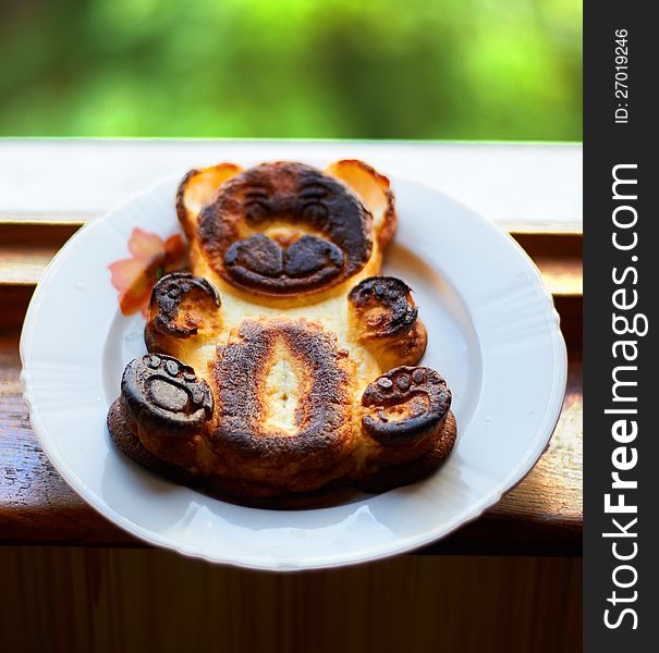 Baked pudding bear, on a white plate